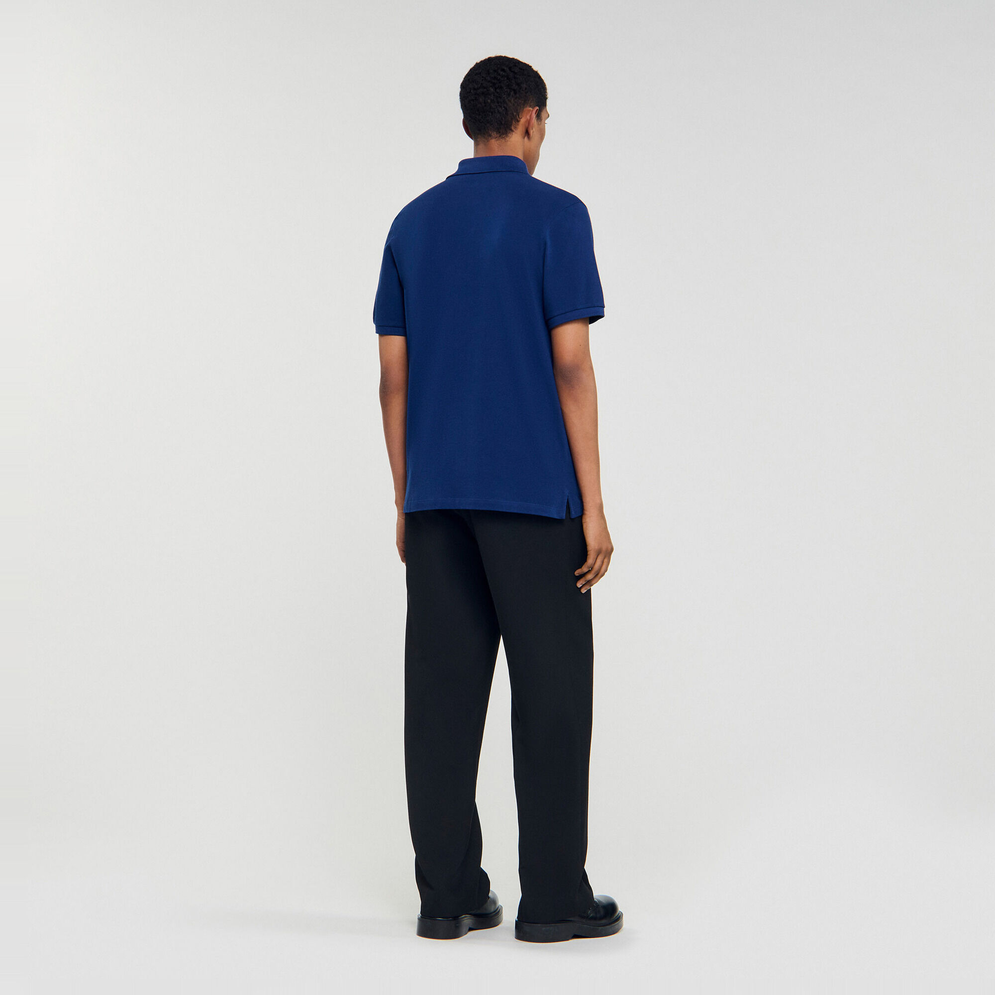 Polo con logo in pelle - Uomo | Sandro