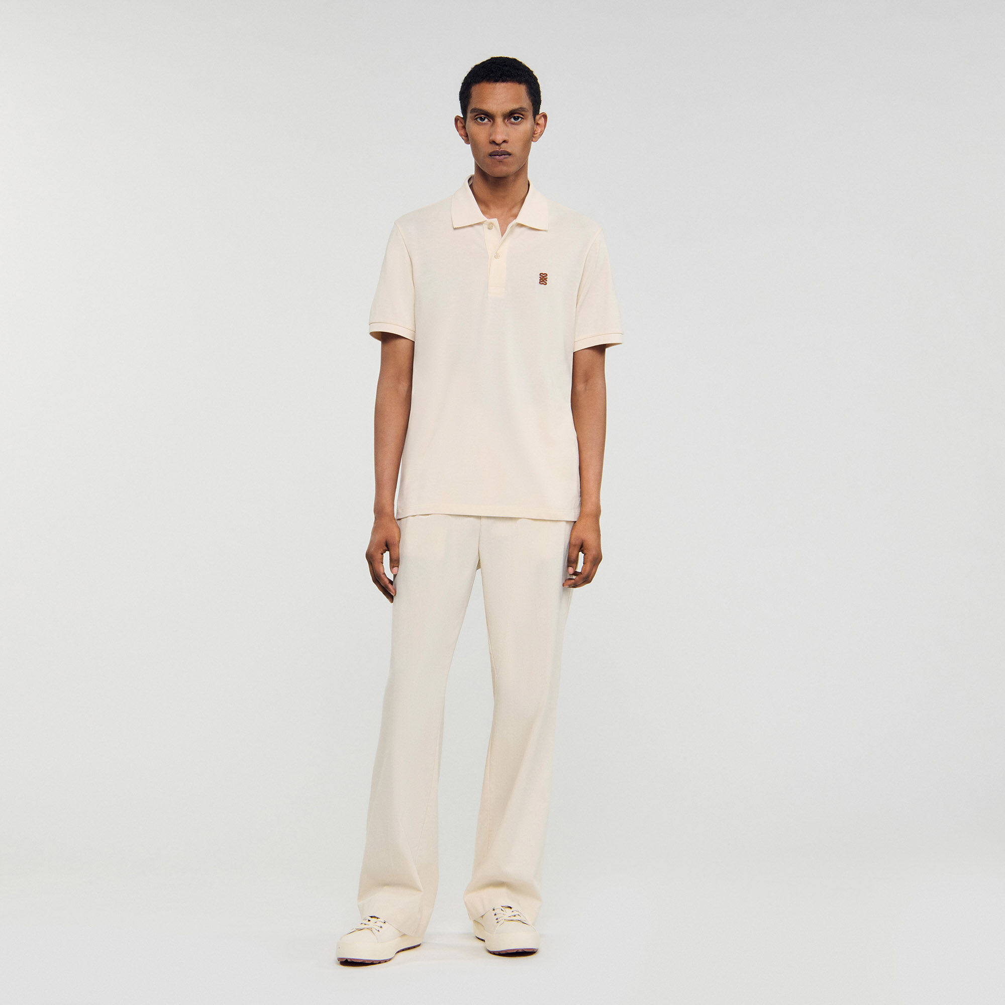 Polo con logo in pelle