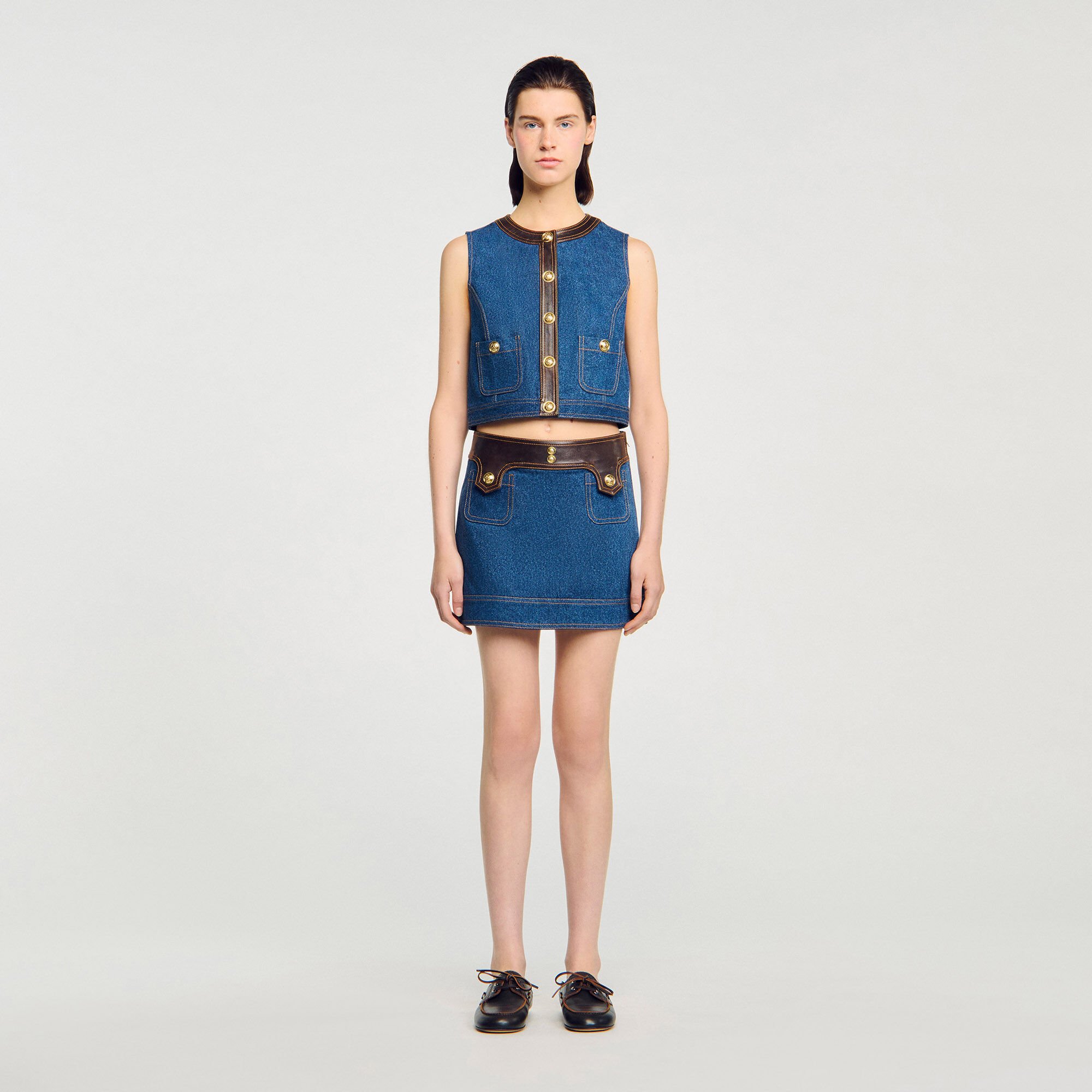 Top in denim e pelle