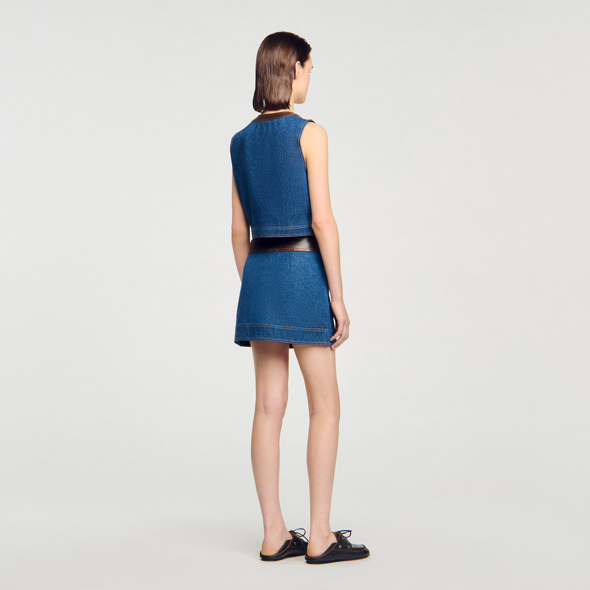 Top in denim e pelle