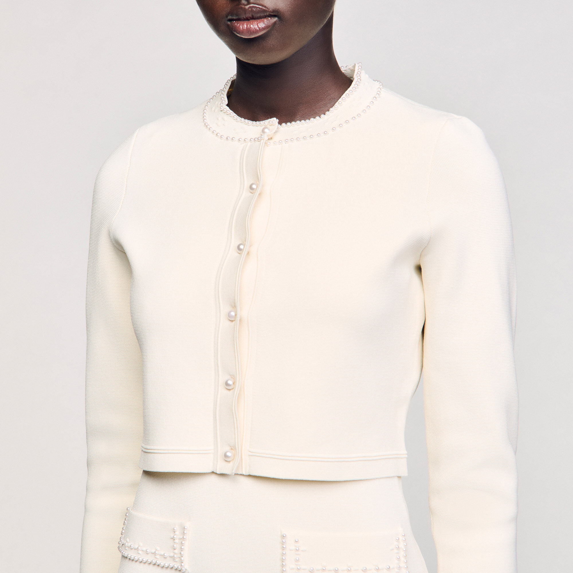 Cardigan corto con perline