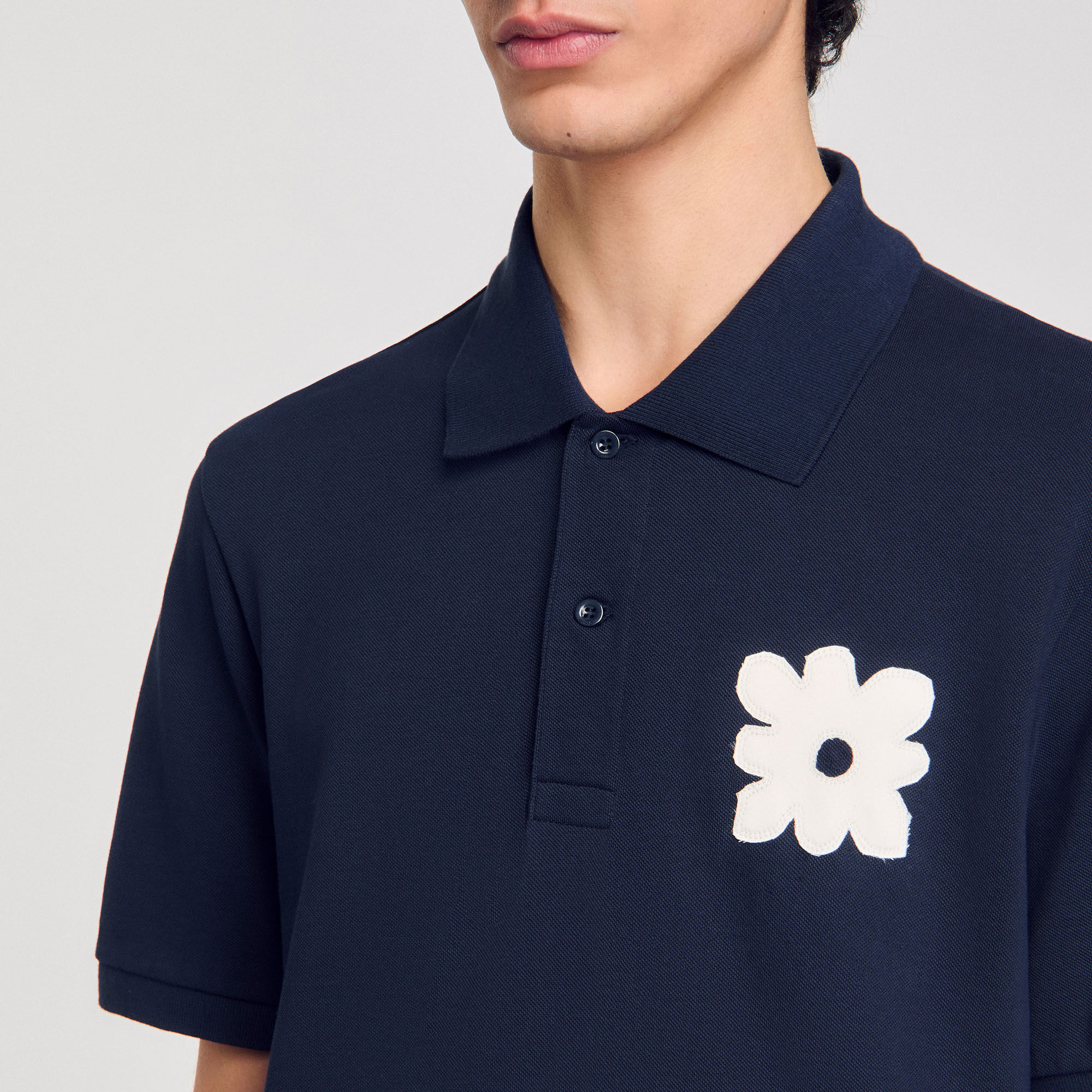 Polo con inserto a fiore