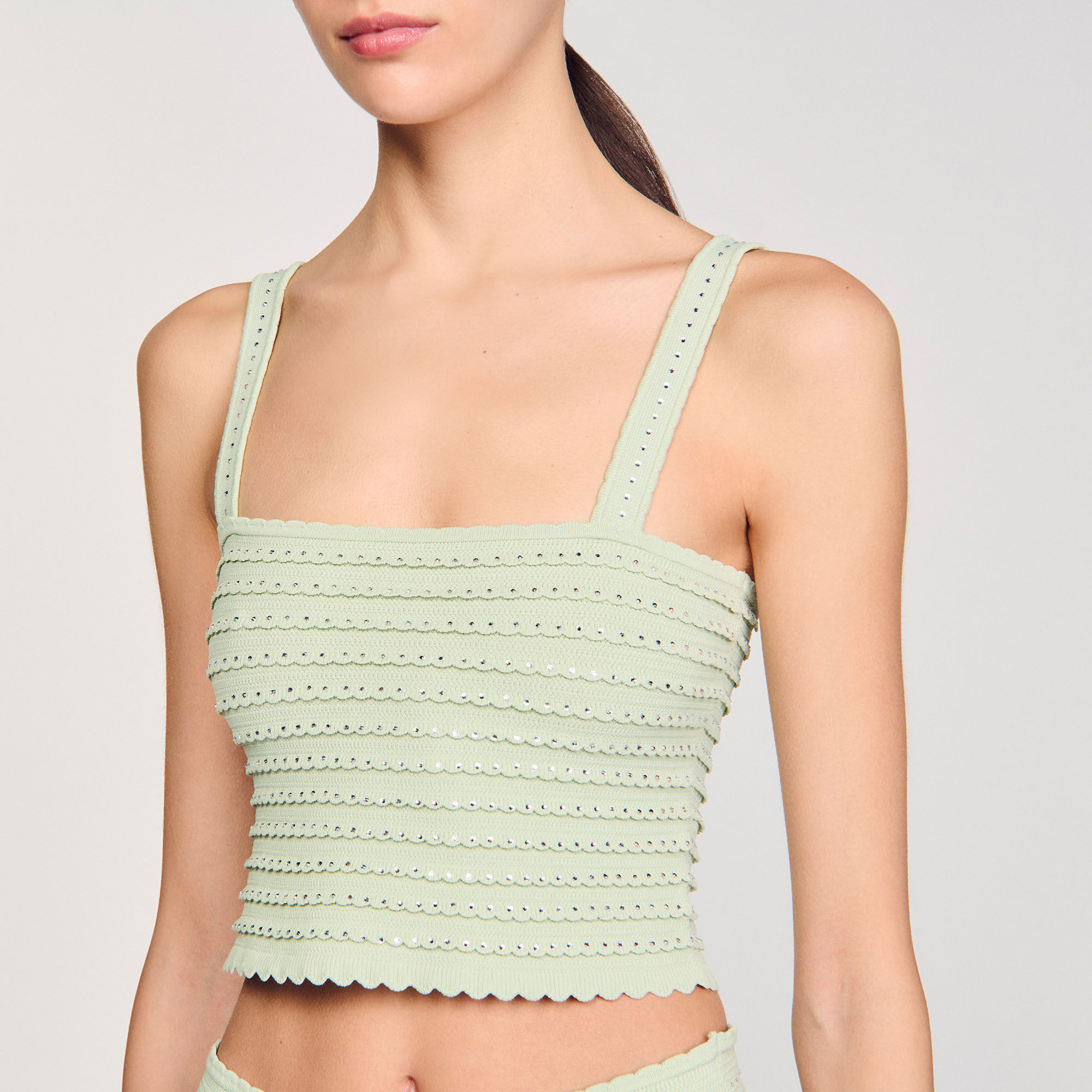 Top corto in maglia glitterata