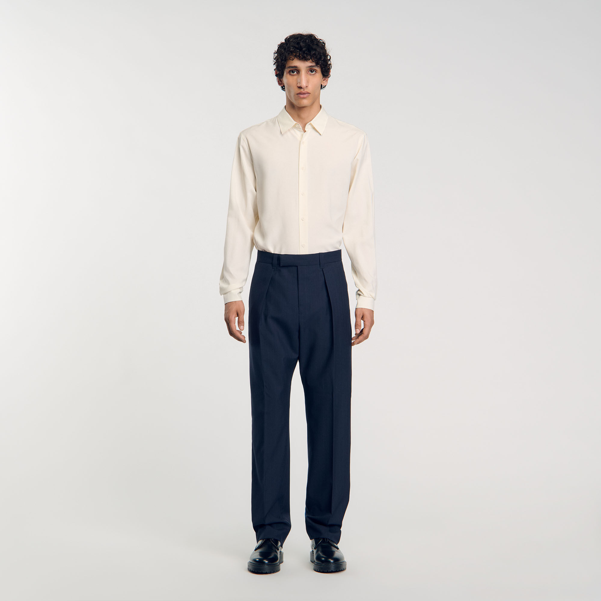 Pantaloni con pieghe baciate