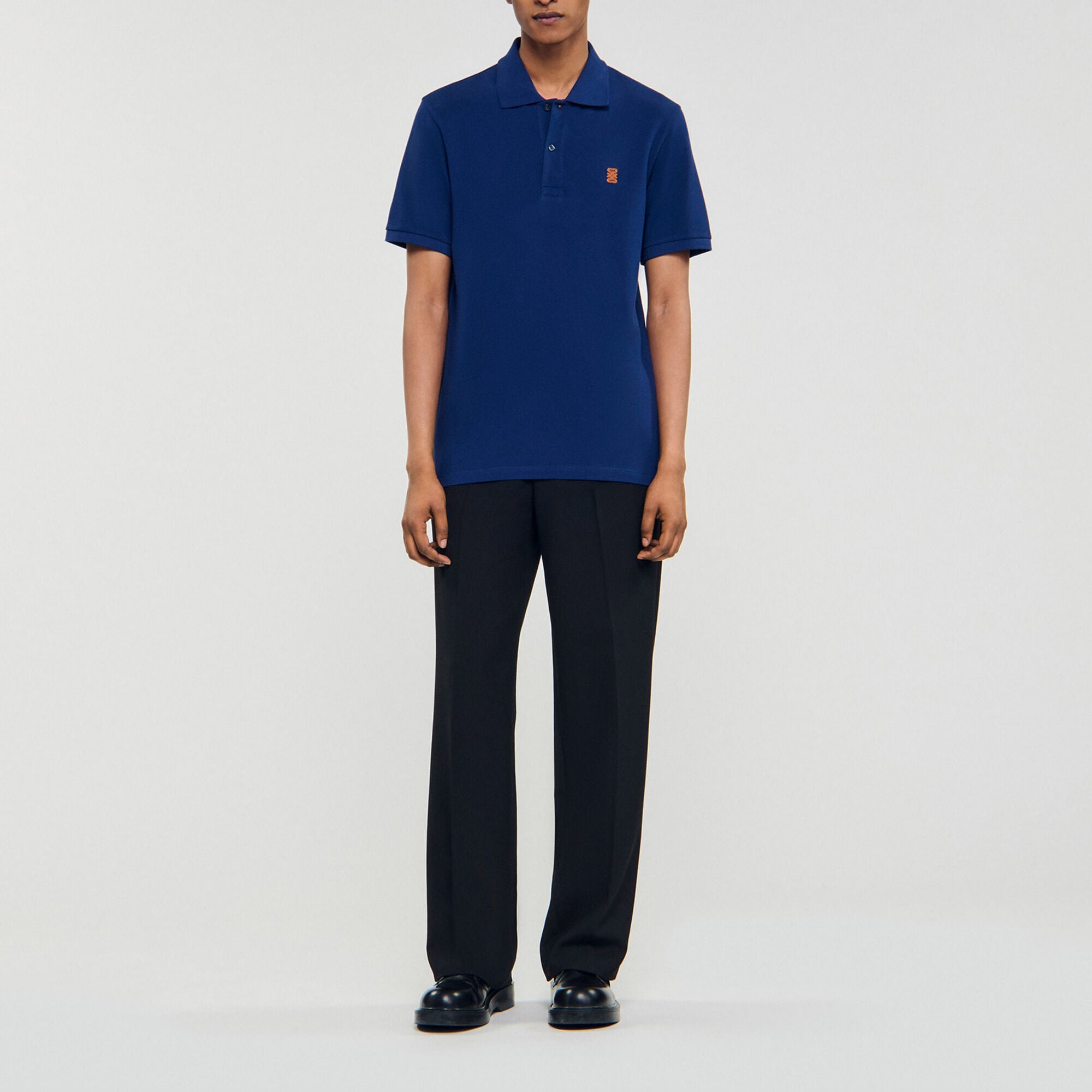 Polo con logo in pelle - Uomo | Sandro