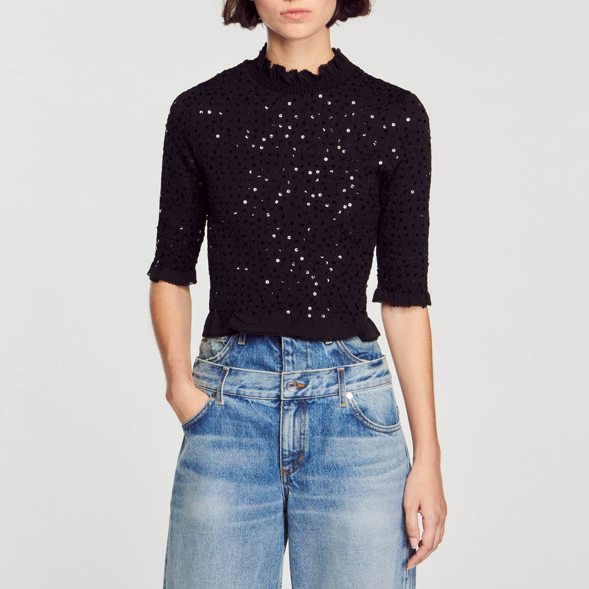 Top ornato da paillettes