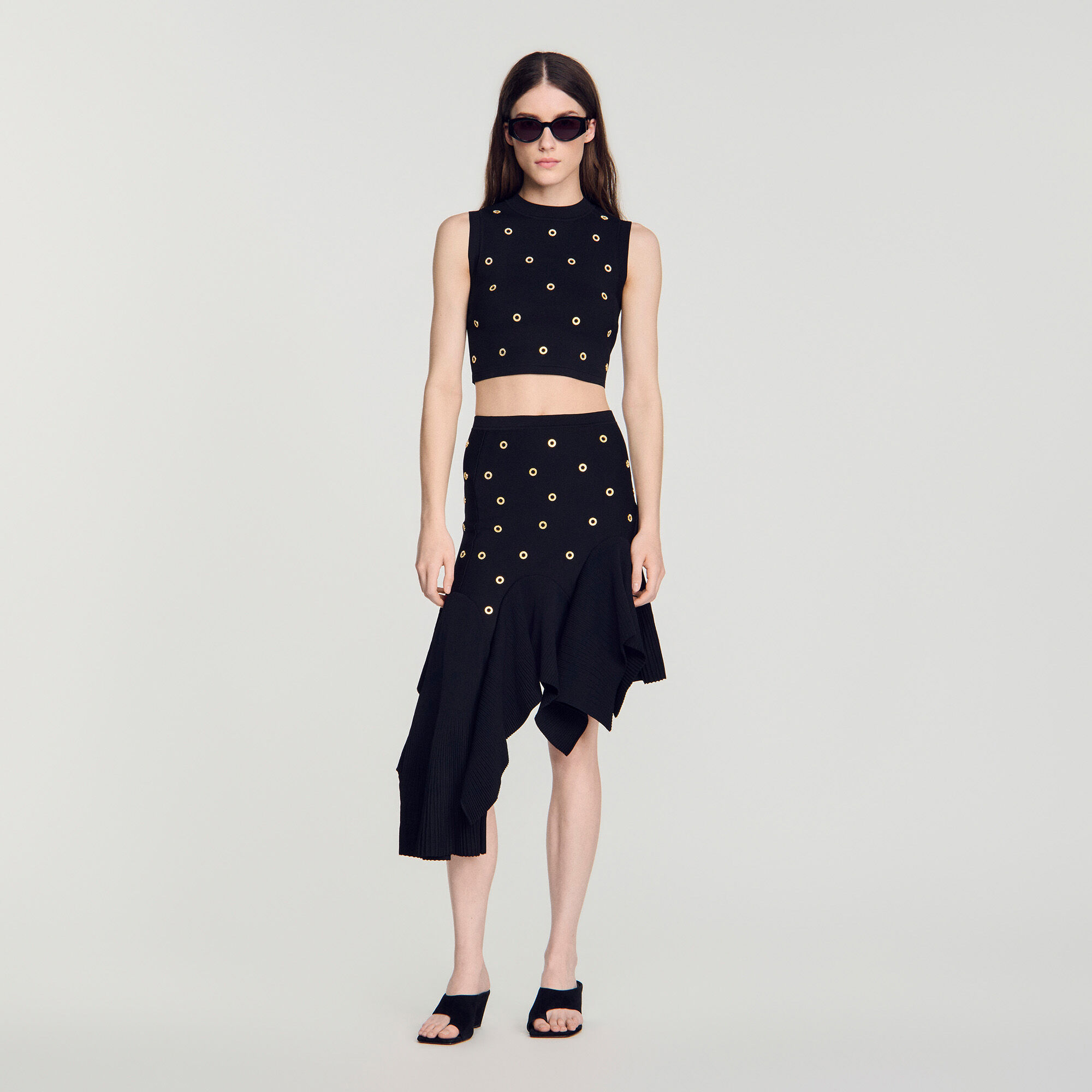 Top in maglia con borchie