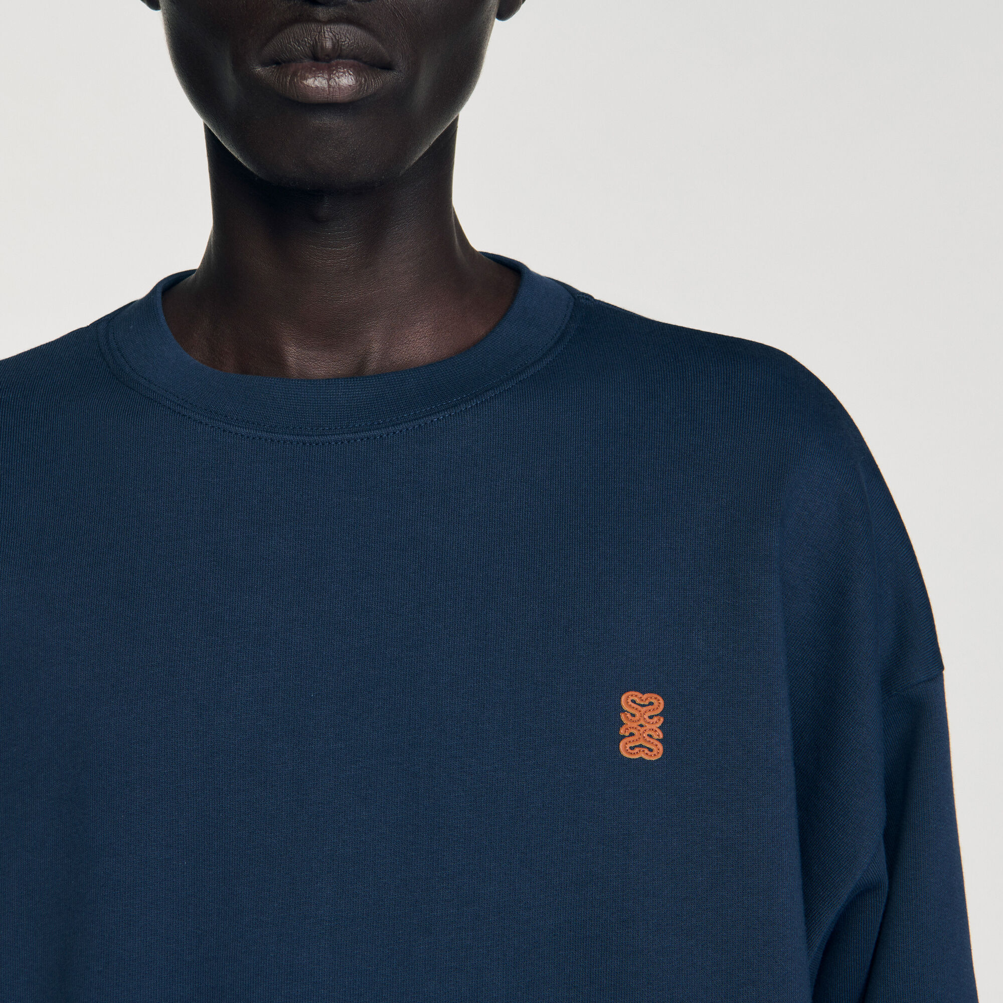 Felpa oversize con inserto in pelle