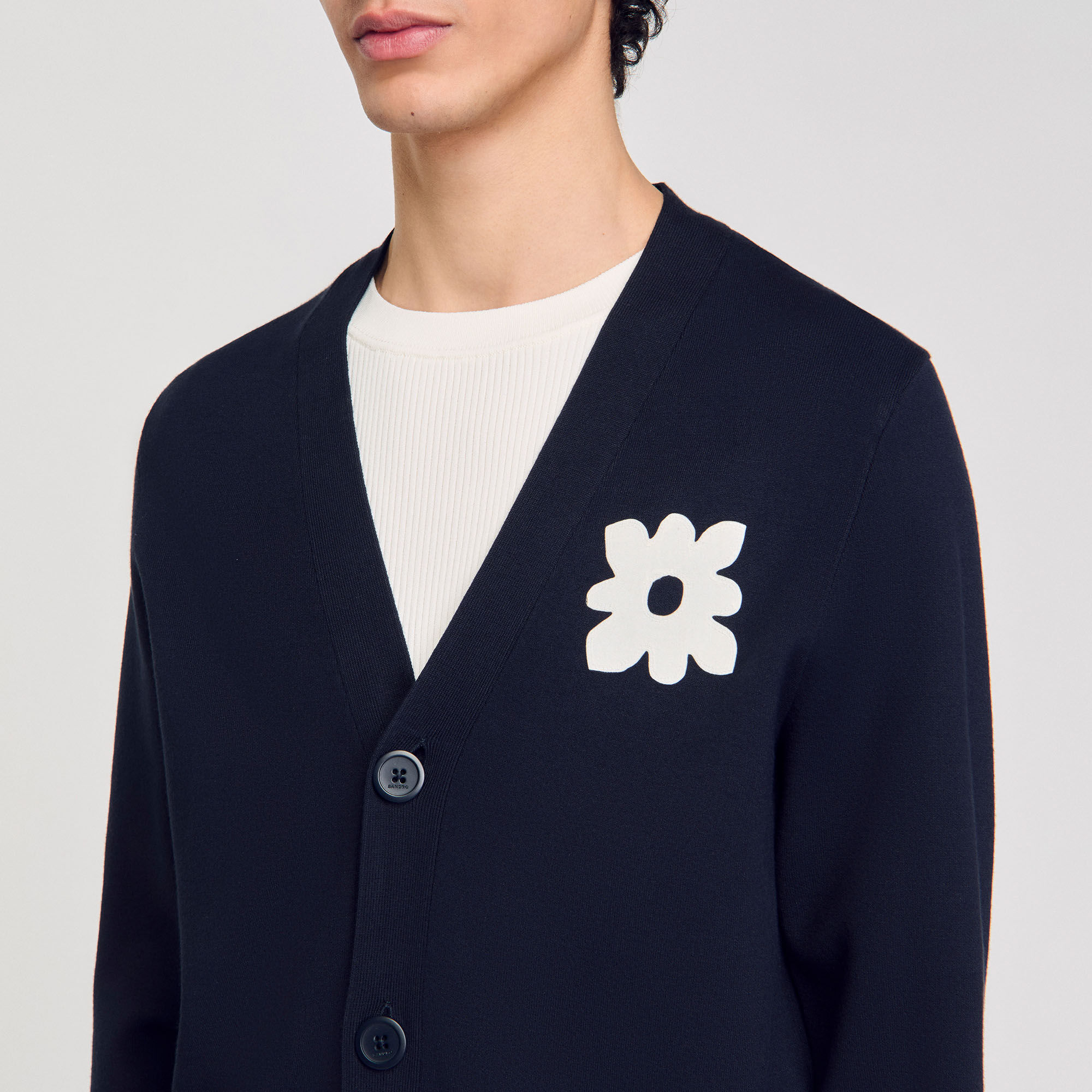 Cardigan con dettaglio a fiore