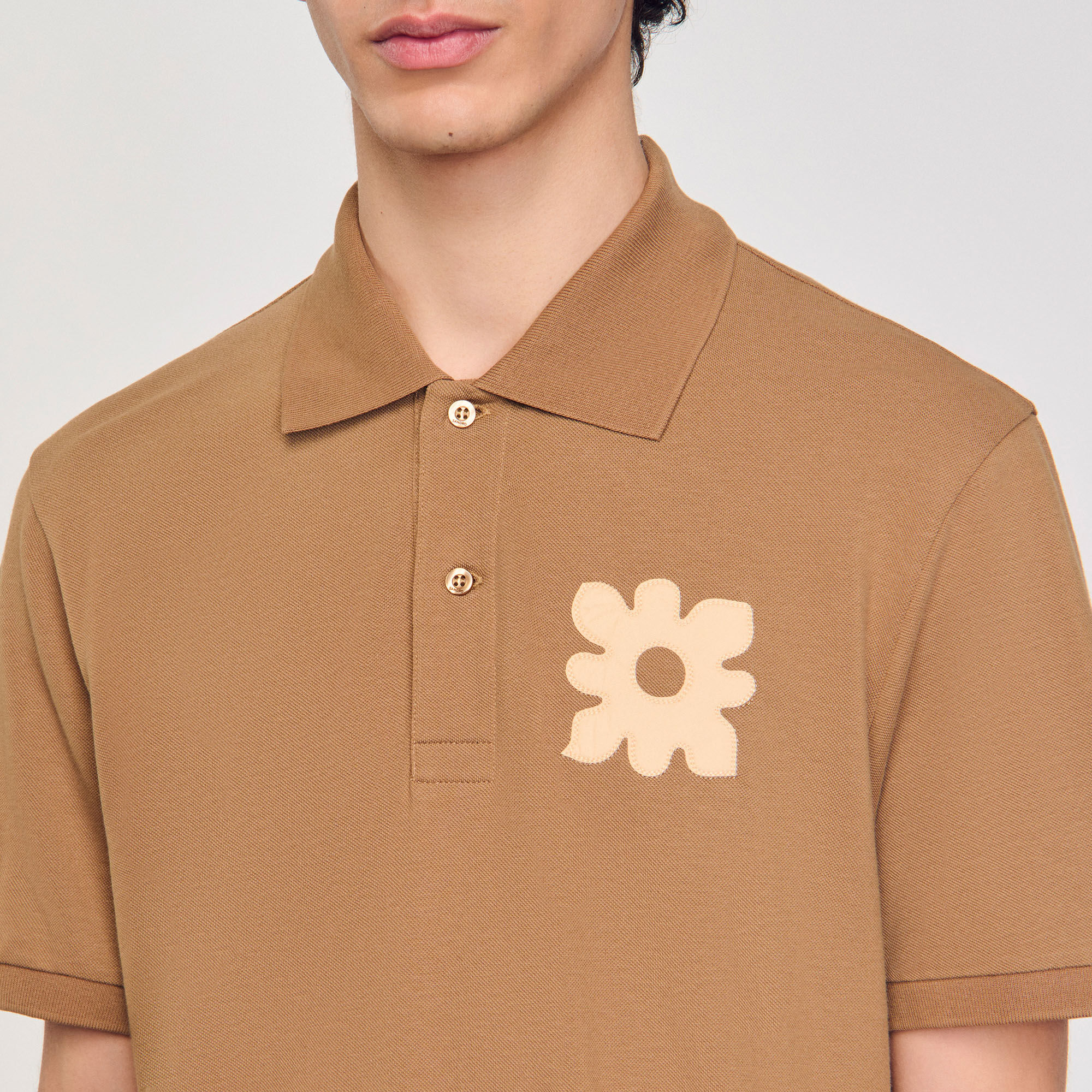 Polo con inserto a fiore