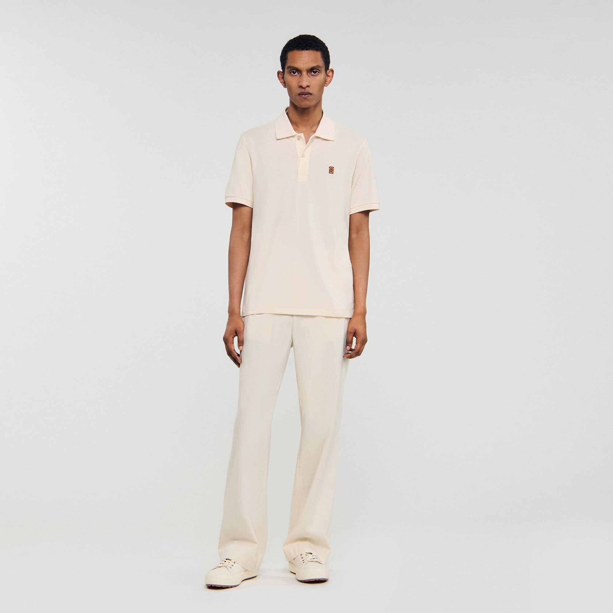 Polo con logo in pelle