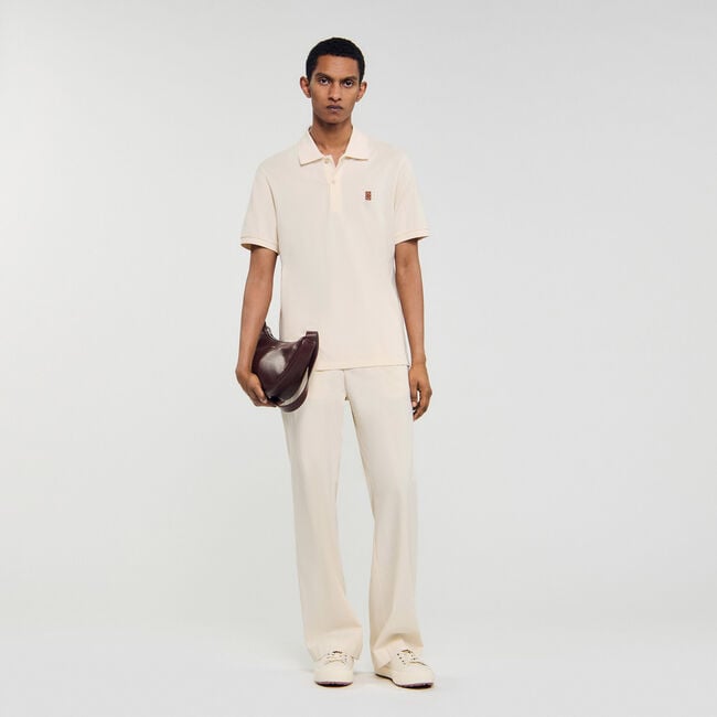 Polo con logo in pelle