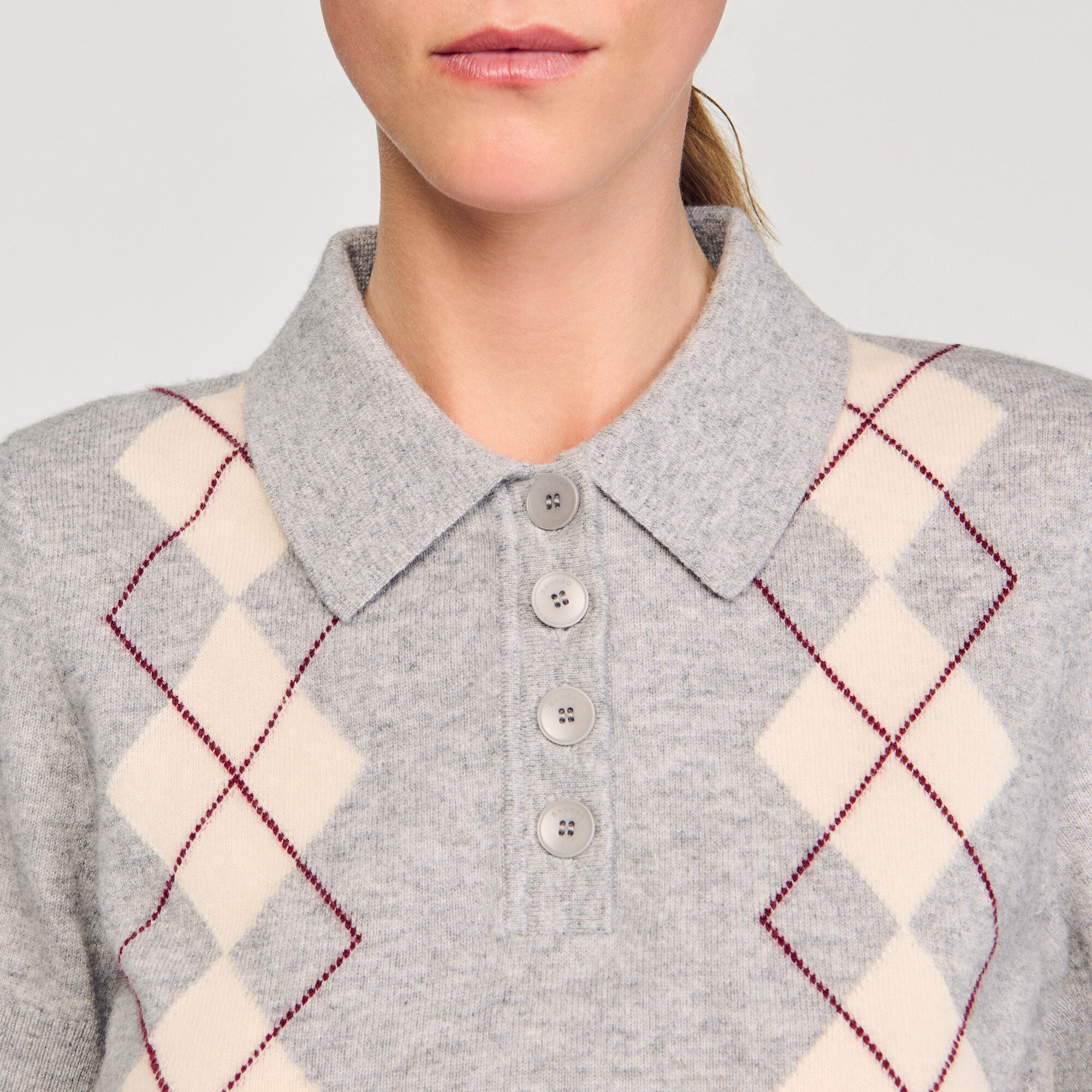 Maglione a rombi con colletto polo