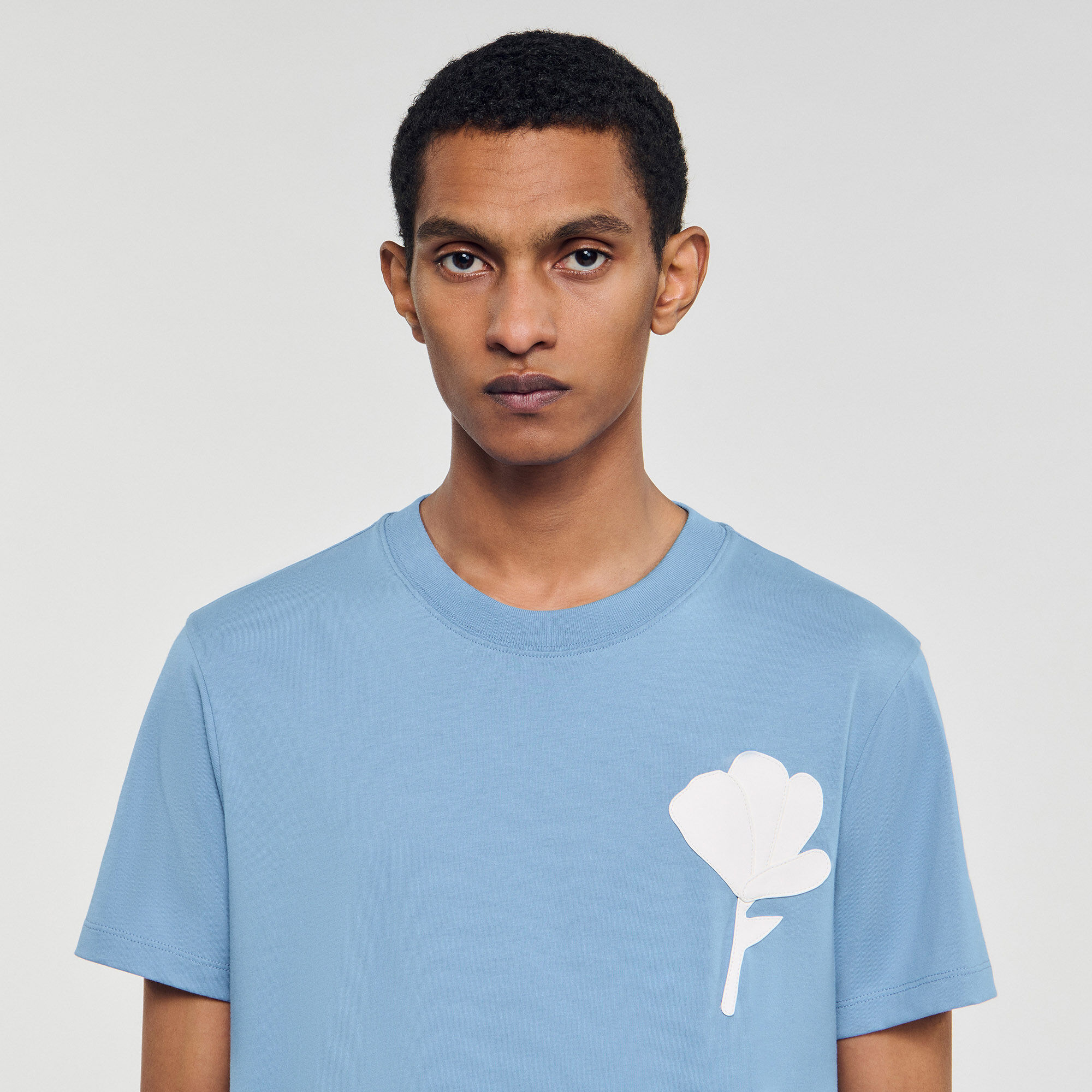 T-shirt con inserto a fiore