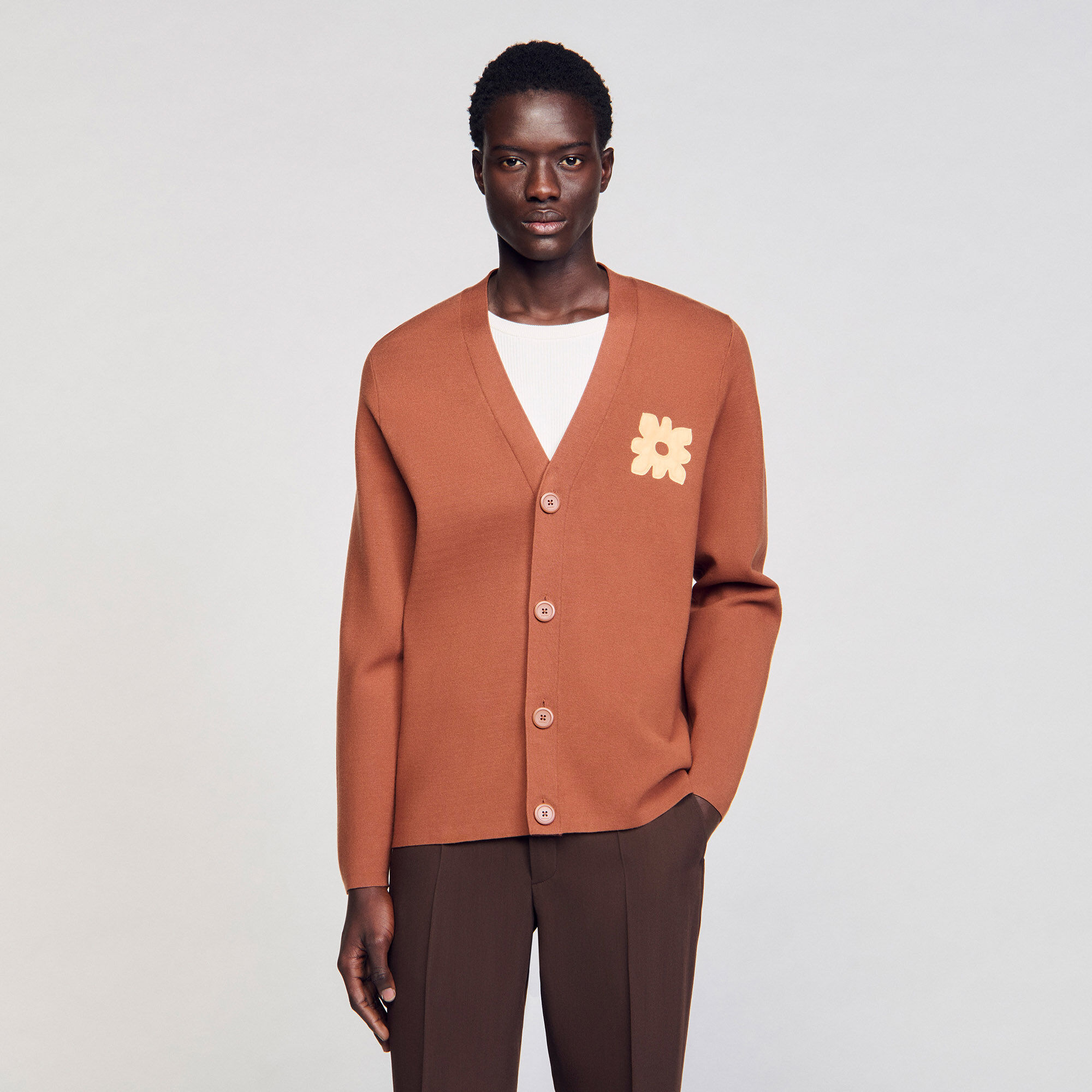 Cardigan con dettaglio a fiore