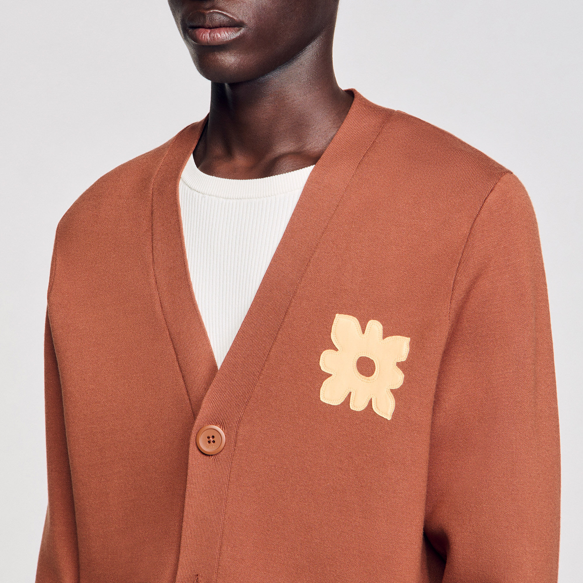 Cardigan con dettaglio a fiore