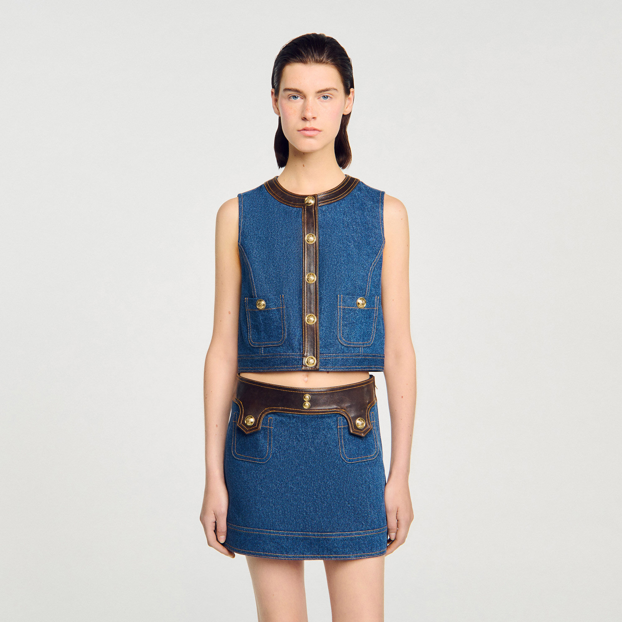 Top in denim e pelle