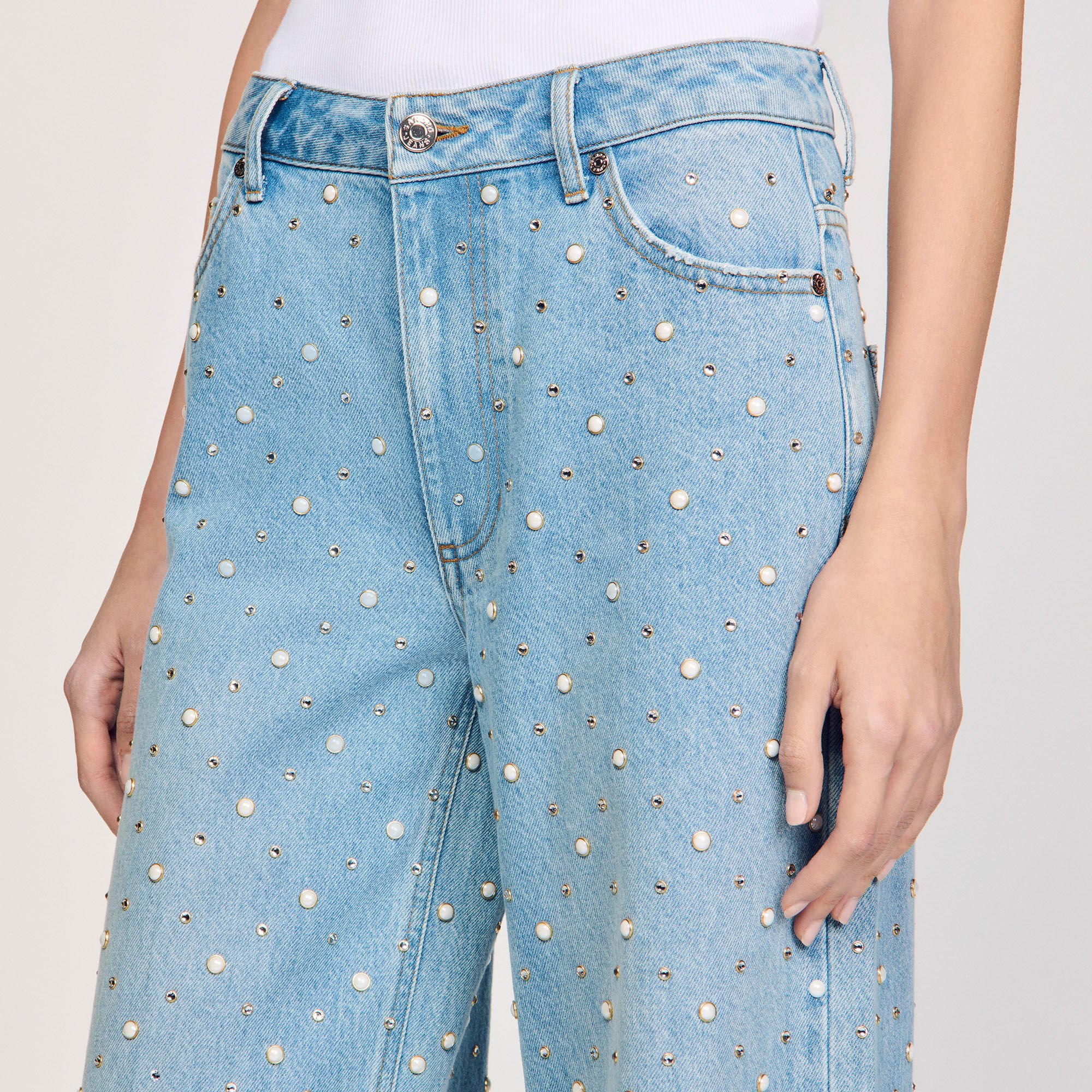 Jeans con strass e perline
