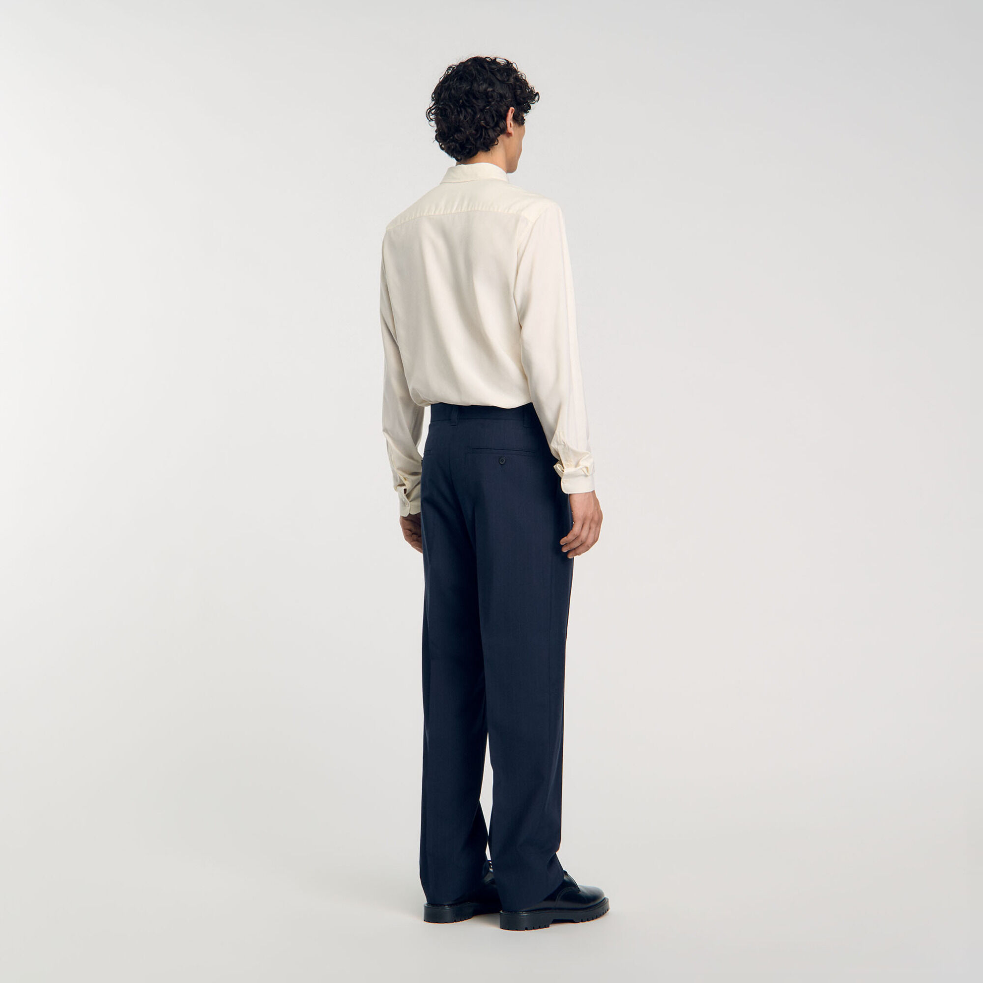 Pantaloni con pieghe baciate