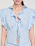 Top glitterato con volant