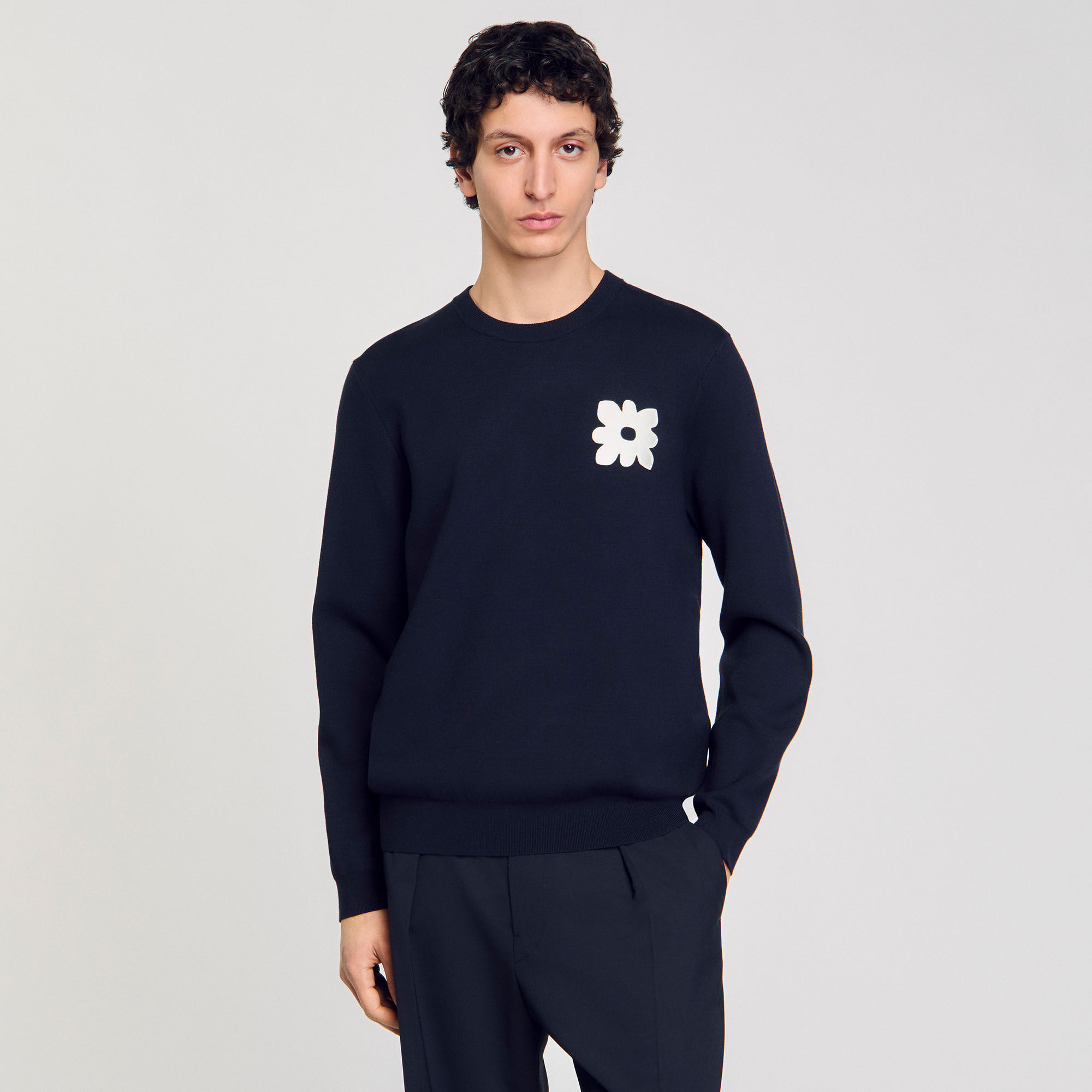 Maglione con dettaglio a fiore