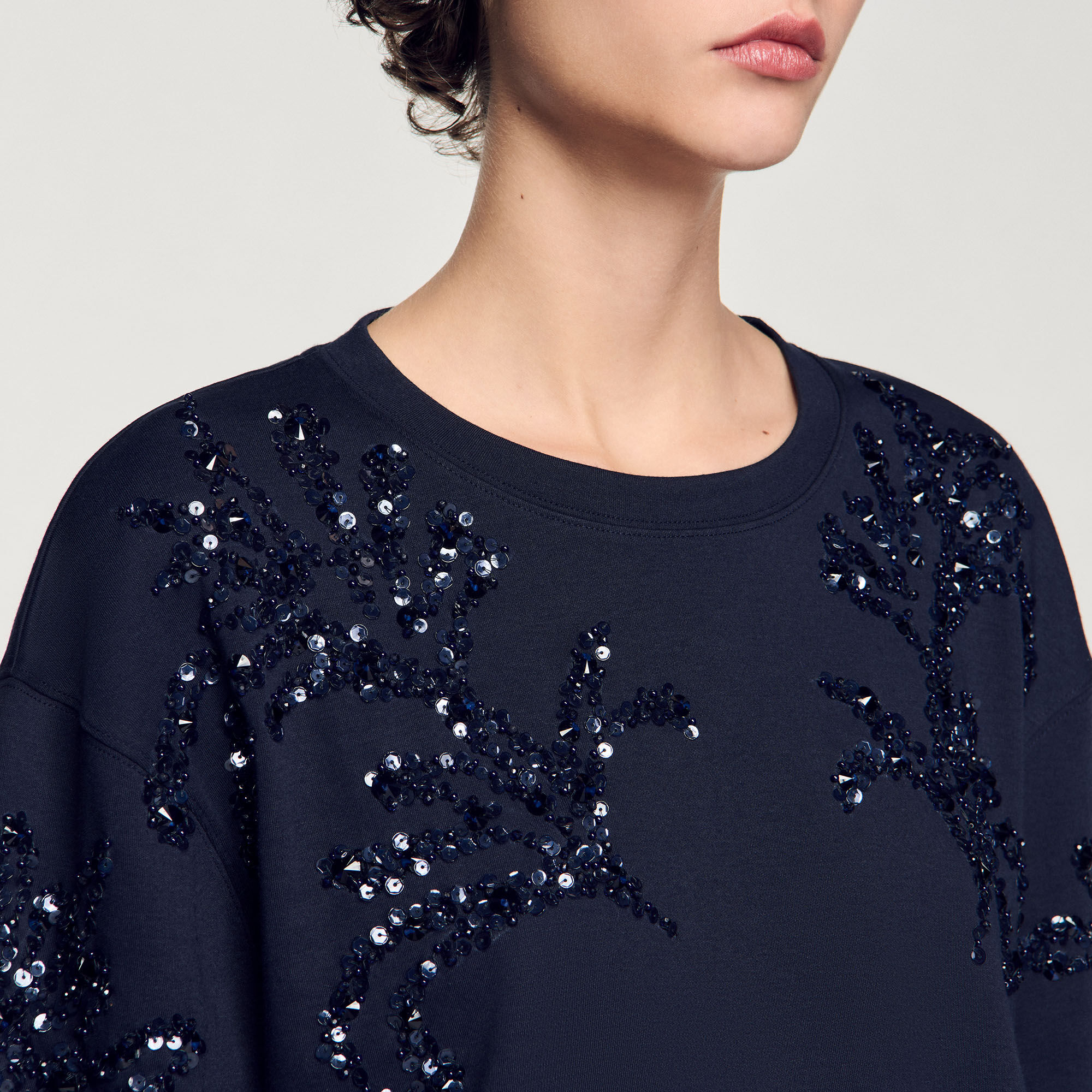 T-shirt con dettagli a perline
