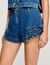 Shorts in denim con volant