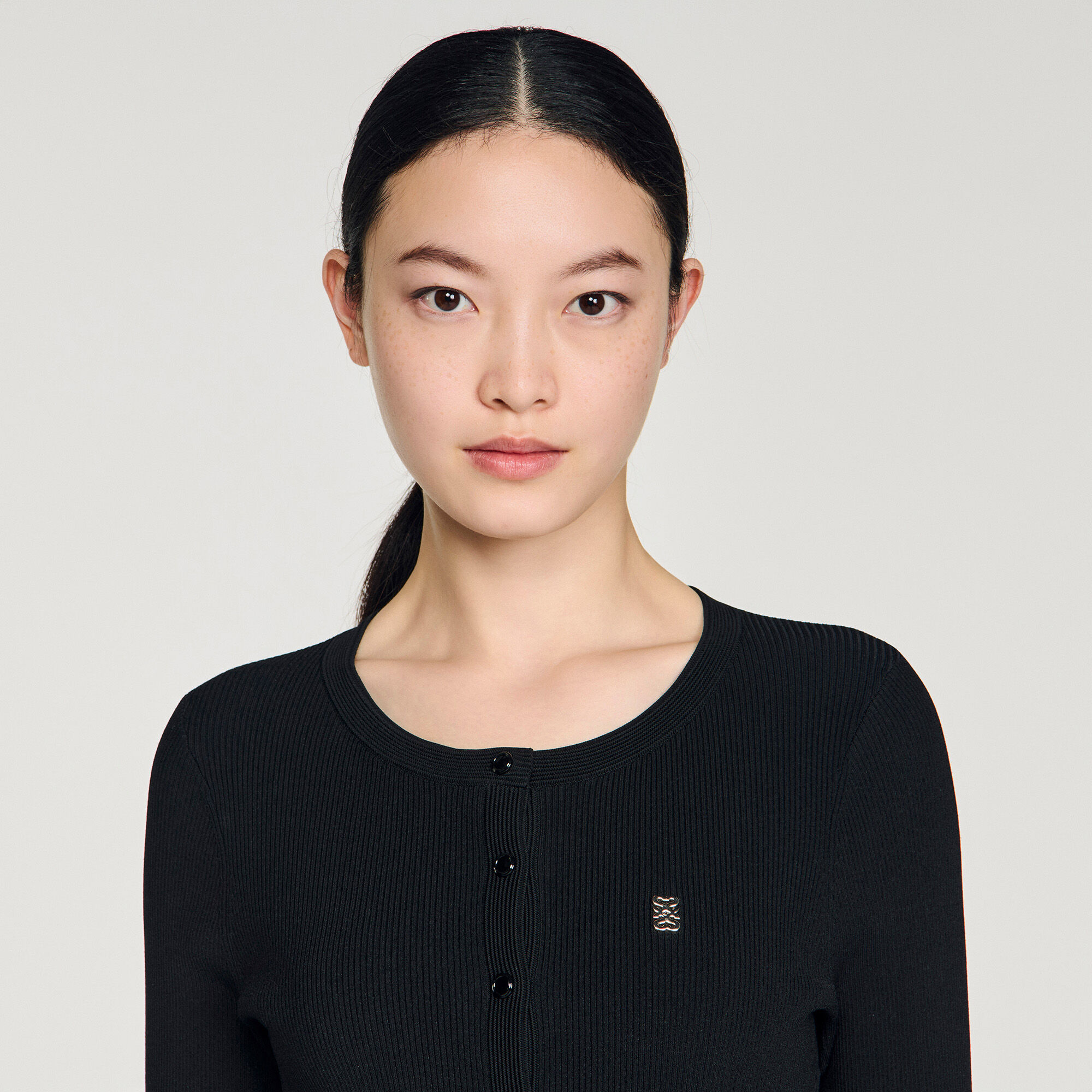 Abito corto in maglia plissettata