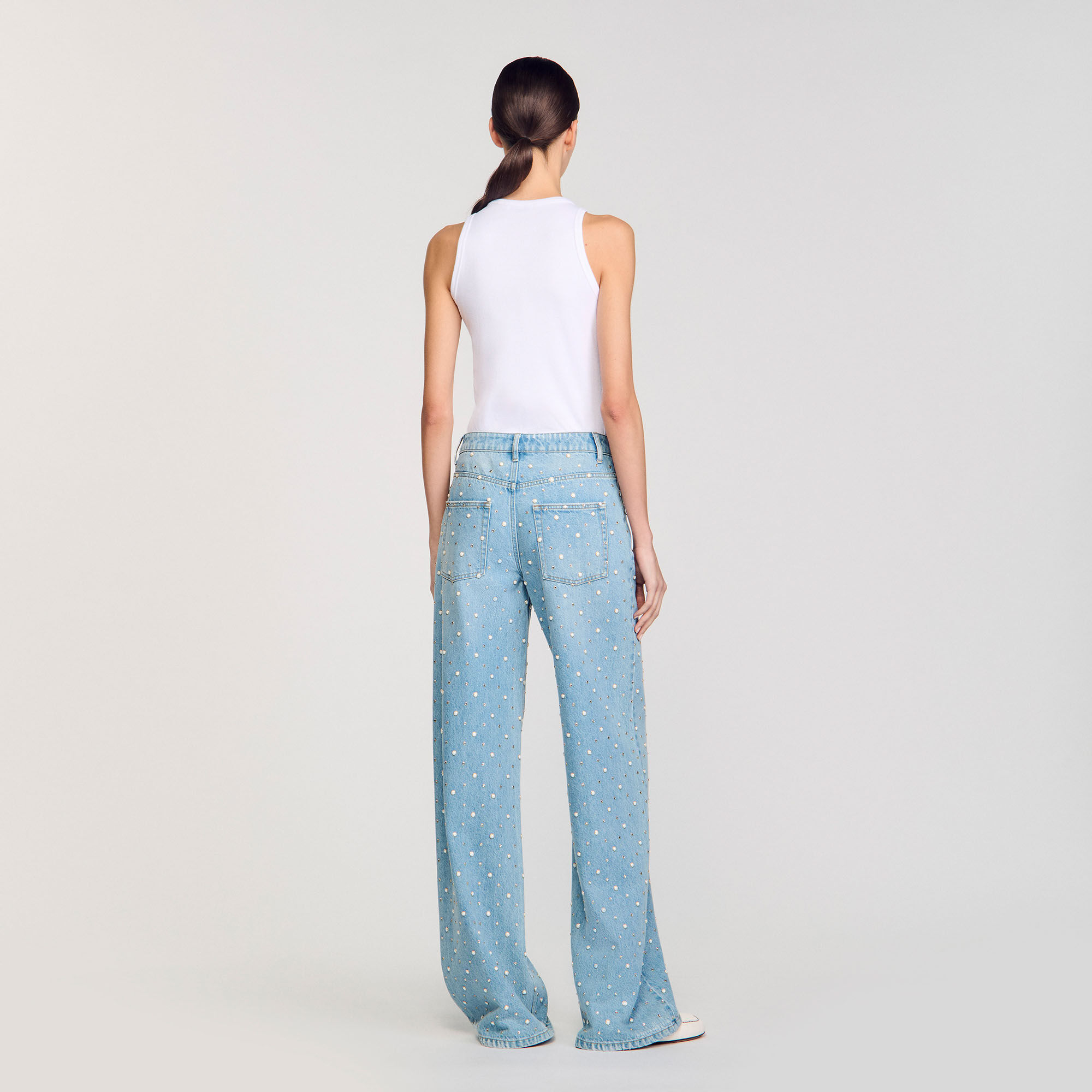 Jeans con strass e perline